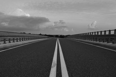 Surface level of empty road against sky