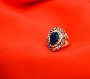 Picture of a fashion ring. red background,