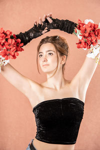 Portrait of woman with red roses