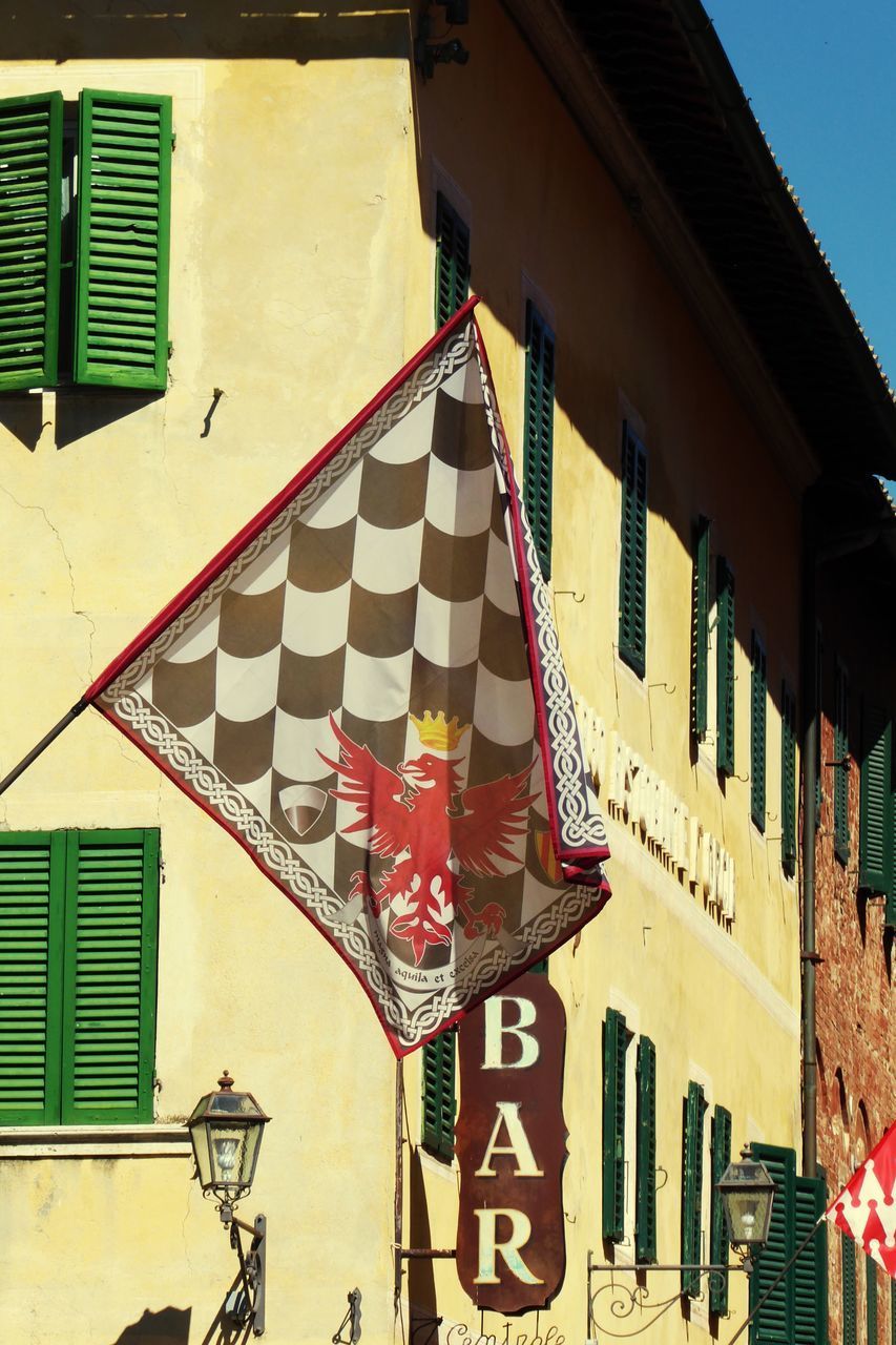 LOW ANGLE VIEW OF FLAGS WITH FLAG