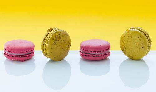 High angle view of multi colored candies against white background