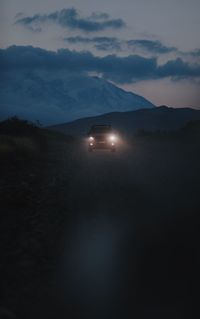 Scenic view of silhouette mountains against sky at dusk