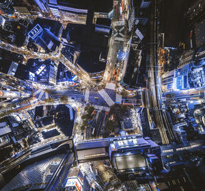 High angle view of illuminated buildings in city at night
