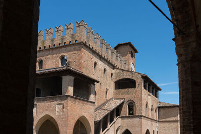 Low angle view of old building against sky