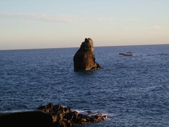 Scenic view of sea against sky at sunset