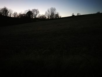 Scenic view of field against clear sky