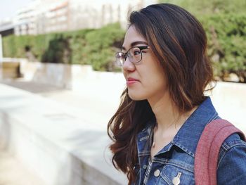 Portrait of a beautiful young woman looking away