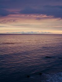 Scenic view of sea against sky at sunset