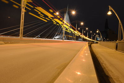 Light trails on suspension bridge at night