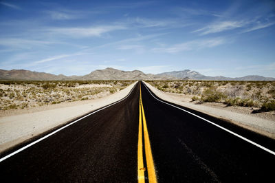 Empty road against sky