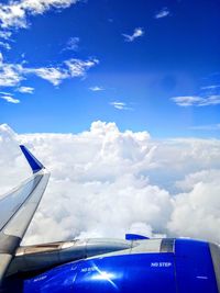 Low angle view of airplane flying in sky