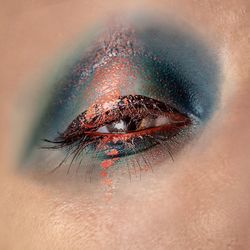 Extreme close-up portrait of woman eye with make-up