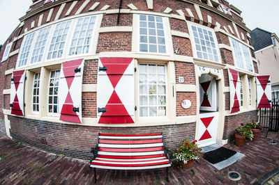 Multi colored flags on building