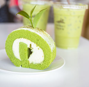 Close-up of green fruit on table