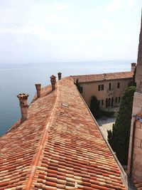 Panoramic view of sea and buildings against sky