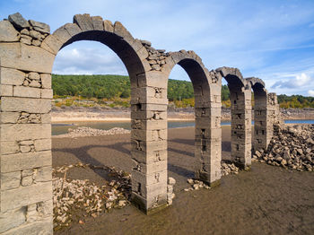 View of old ruin building against cloudy sky