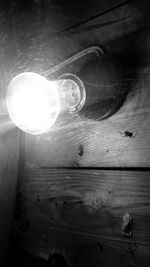 Close-up of light bulb on table