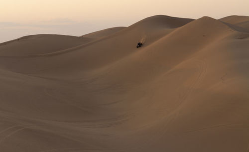 Riding the dunes at sunrise