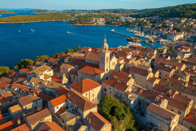 High angle view of townscape by sea