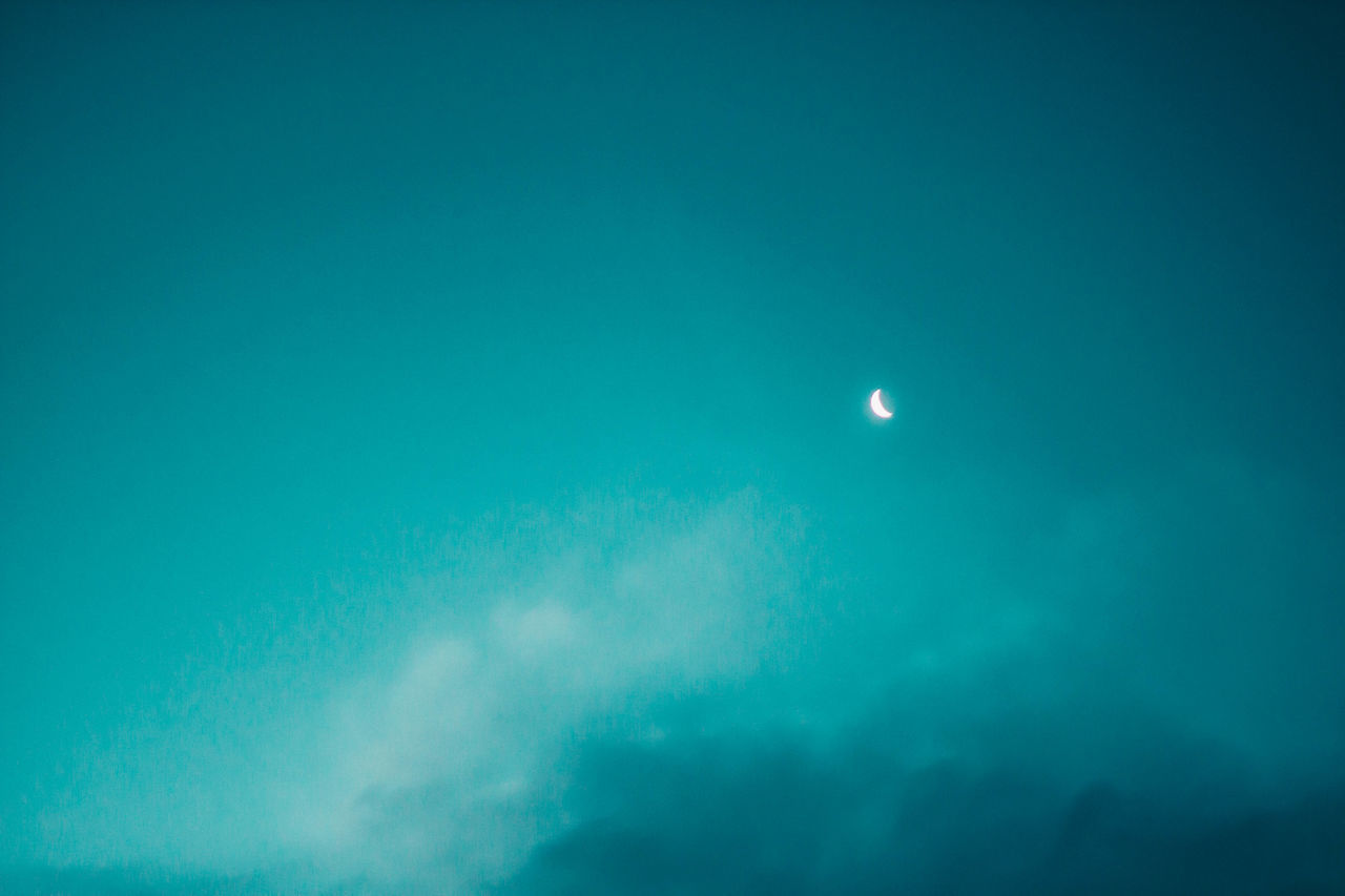 LOW ANGLE VIEW OF MOON AGAINST SKY