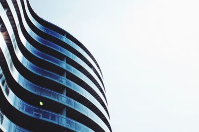 Low angle view of skyscraper against clear sky