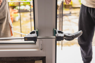 Midsection of man standing in gym