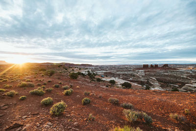 Golden light of sunrise over camp at the edge of the maze in utah