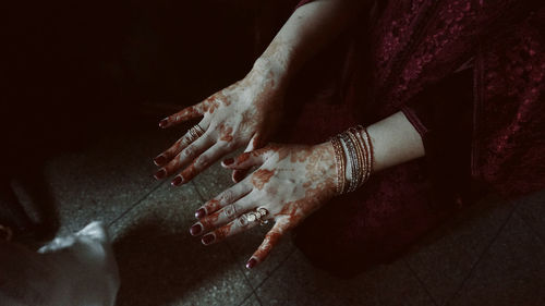 High angle view of woman sitting on floor