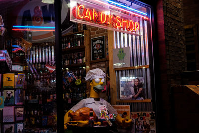 View of illuminated store at restaurant