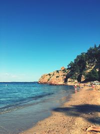 Scenic view of beach against clear sky