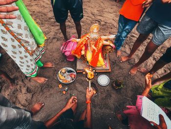 Low section of people holding food