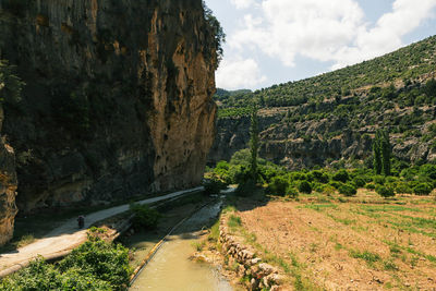 Scenic view of mountains against cloudy sky