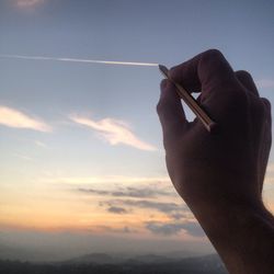 Optical illusion of hand drawing line in sky