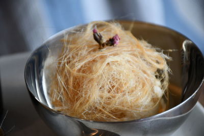 Close-up of noodles in bowl on table