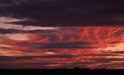 Low angle view of dramatic sky during sunset