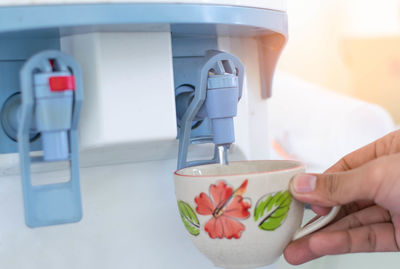 Close-up of hand holding ice cream