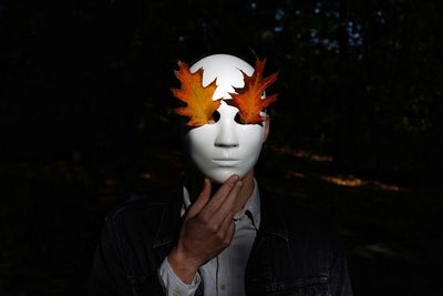 Person wearing mask with maple leaf