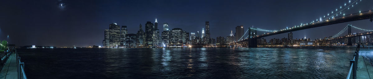 Night panoramic view of financial district of new york from brooklyn