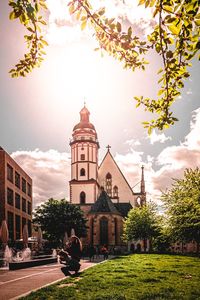 View of buildings against cloudy sky