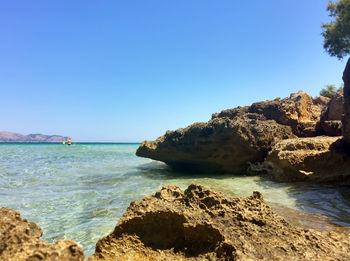 Scenic view of sea against clear blue sky
