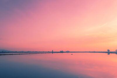 Scenic view of sea against romantic sky at sunset