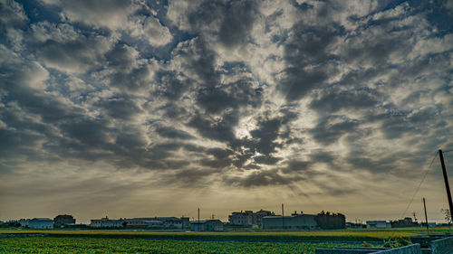 Scenic view of field against sky during sunset