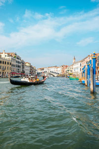 View of boats in sea against buildings