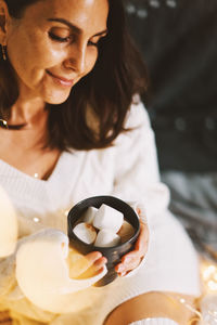 Portrait of young woman having drink