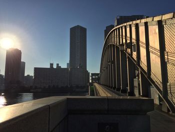 Modern cityscape against sky during sunset