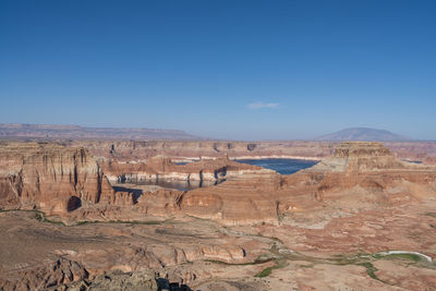 Lake powell with historical low water levels seen from alstrom point during drought in may 2022.