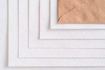 High angle view of paper on white wall