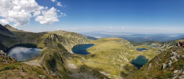 Panoramic view of mountains against blue sky