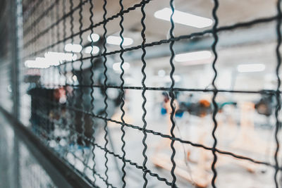 Close-up of fence against window