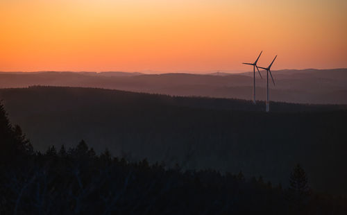 Scenic view of silhouette landscape against sky during sunset